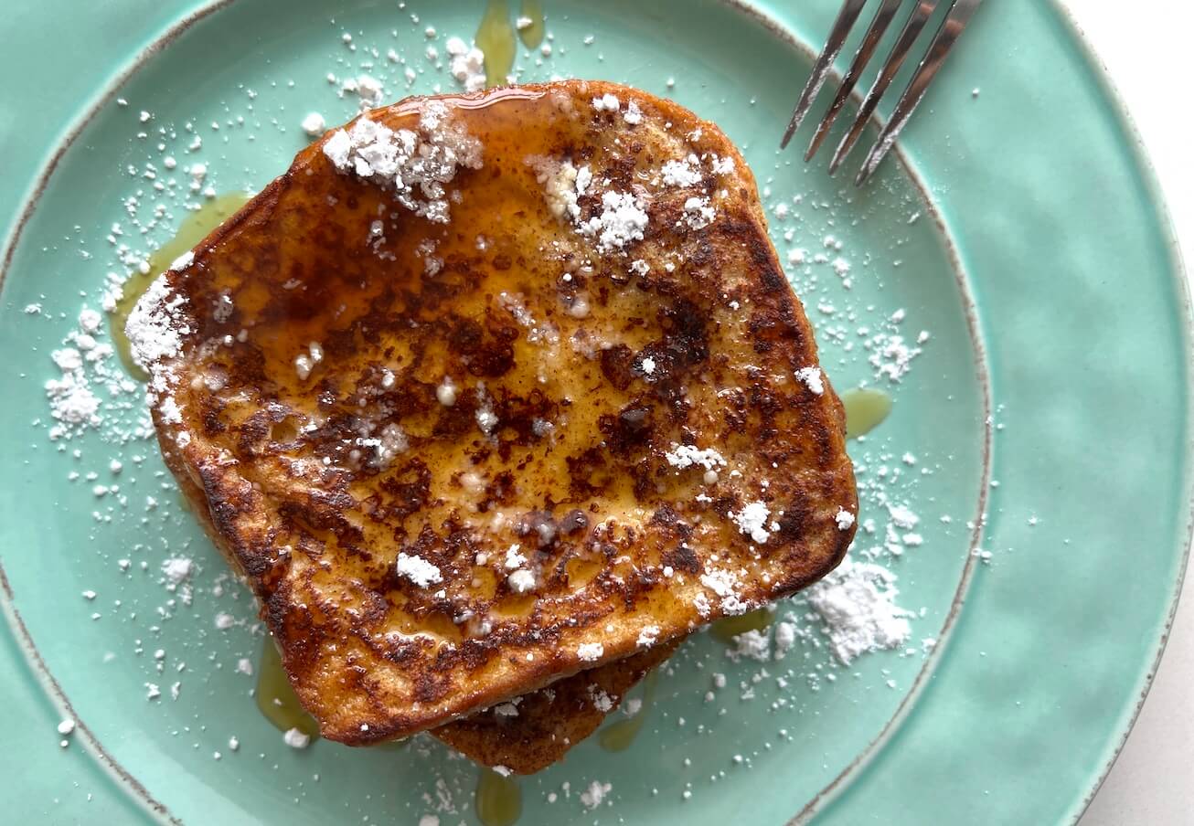 French toast with maple syrup and powdered sugar