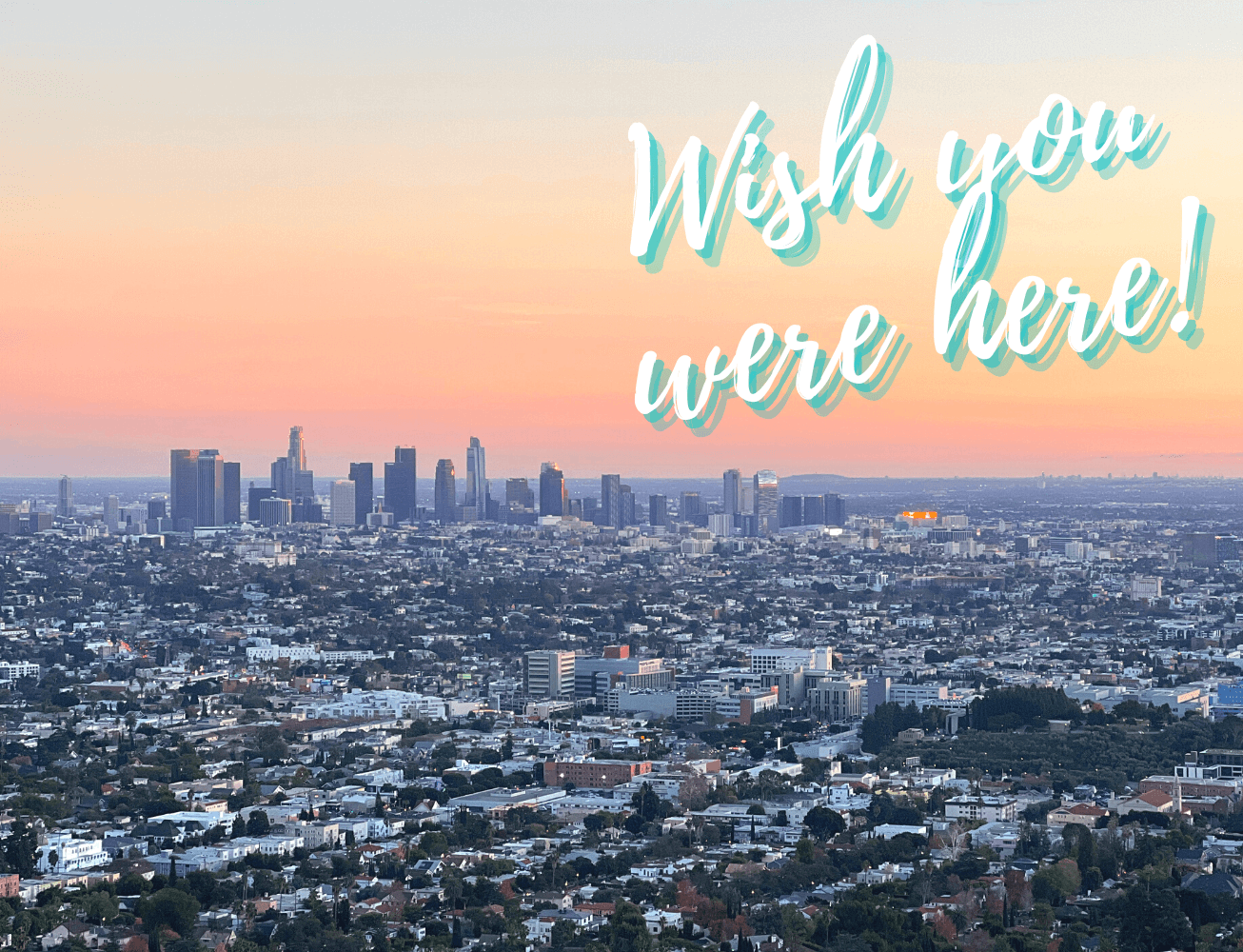 Los Angeles skyline at sunset with text that reads with you were here