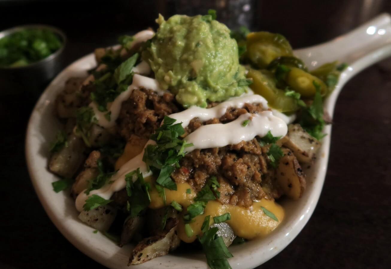 Graze's loaded potatoes in white skillet